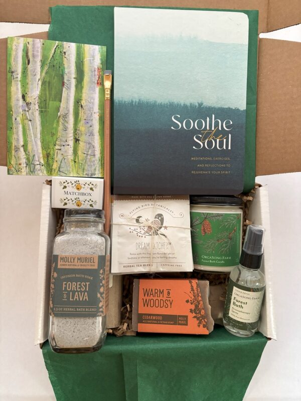 This gift box around the theme of a walk in the forest contains relaxing bath salts, soap, candle, & a guided journal